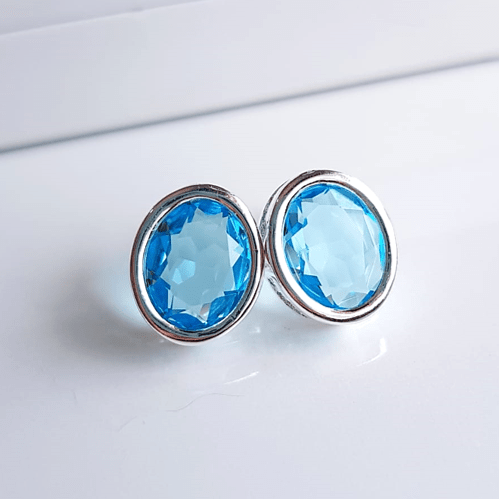 Brinco botão de cristal oval 14x12mm azul aquamarine - banhado a prata