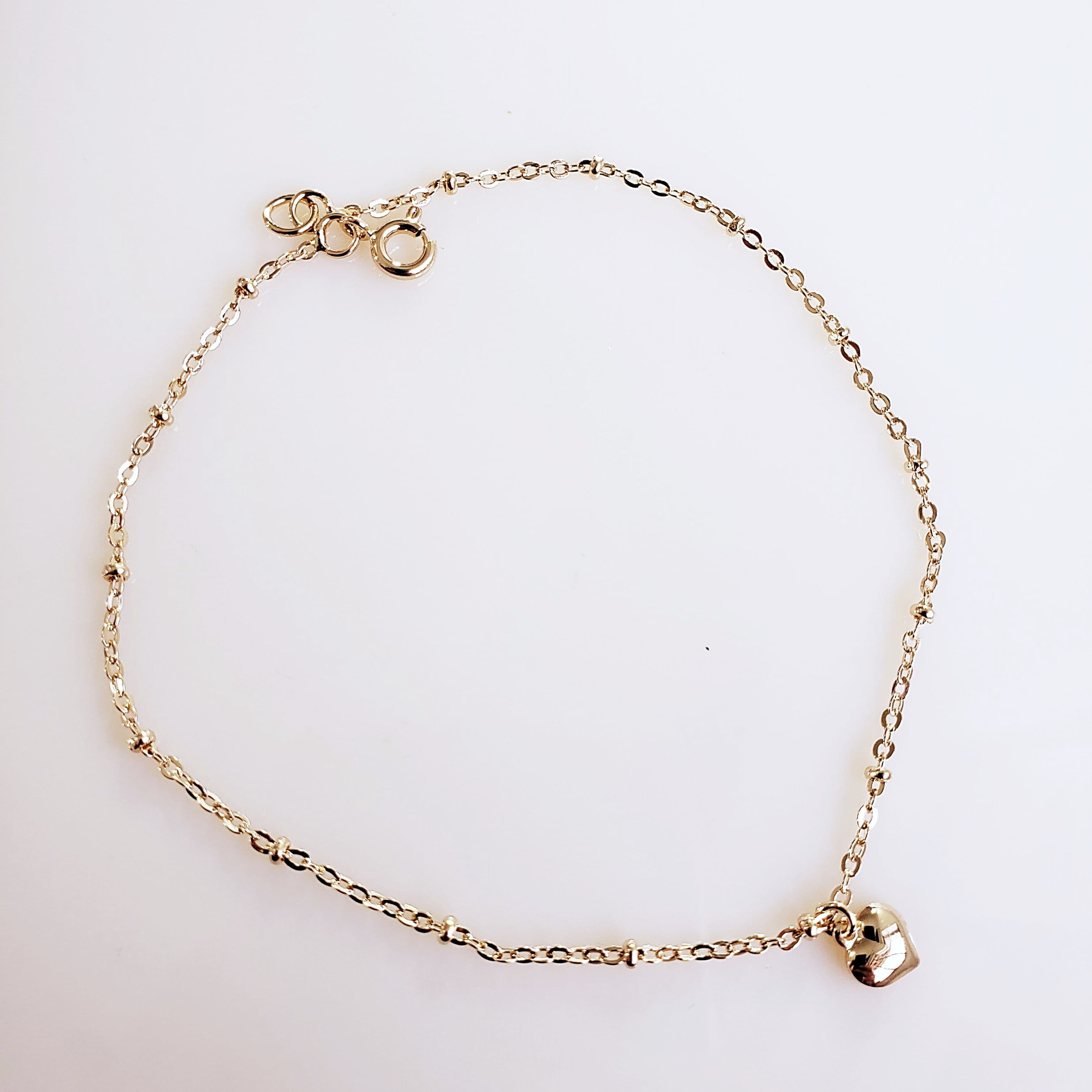 Tornozeleira com bolinhas e pingente de coração - banhado a ouro