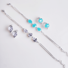 Conjunto brinco + pulseira - com cristais azul claro fusion - banhado a prata  